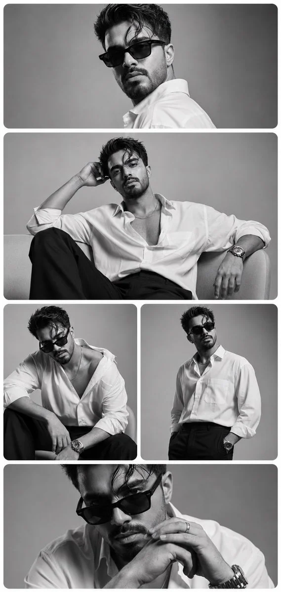A man in black sunglasses poses for a luxury editorial portrait
