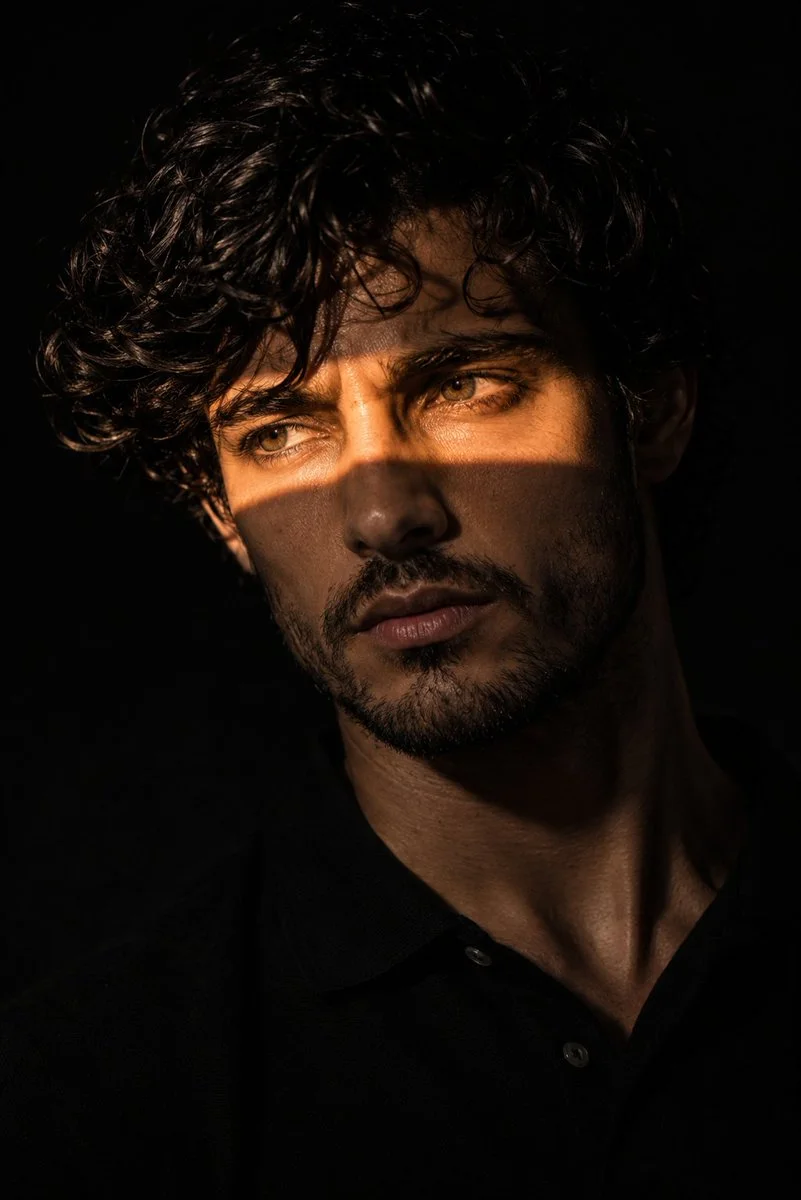 A mysterious man with a golden light beam across his eyes