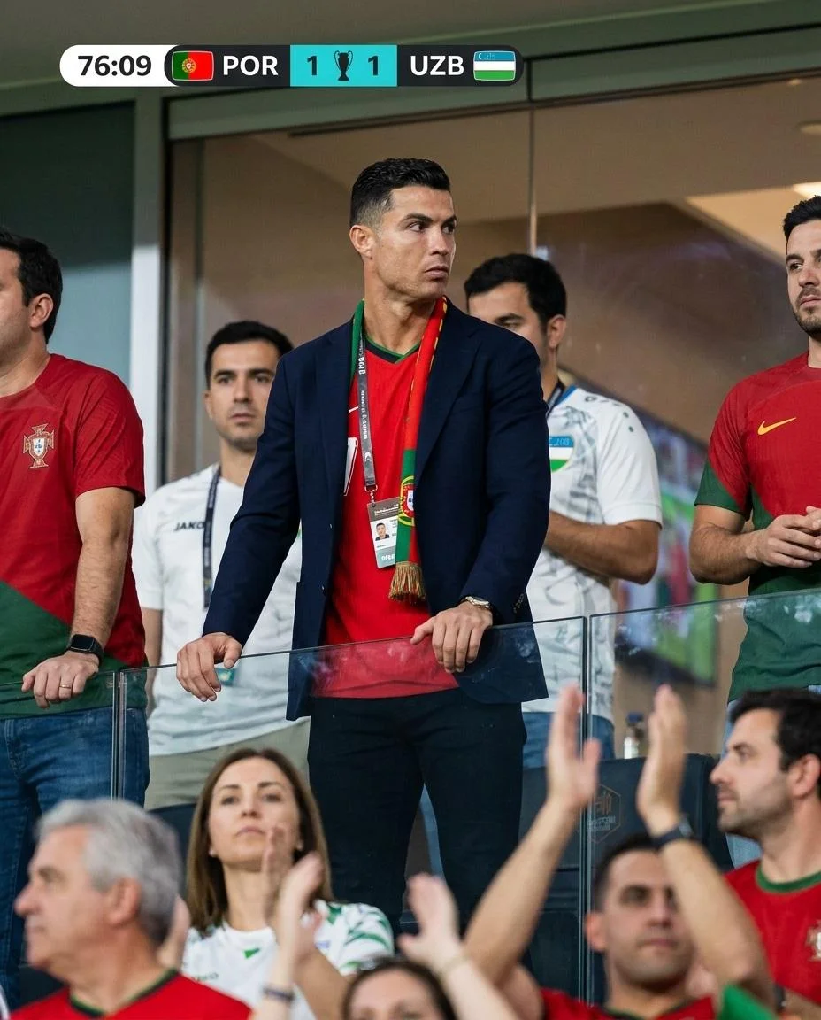 A tense fan watches the final minutes from a VIP suite.