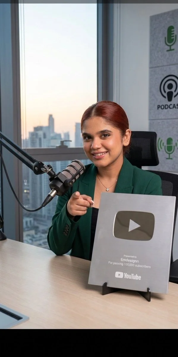 A young YouTuber holds her silver play button award with pride