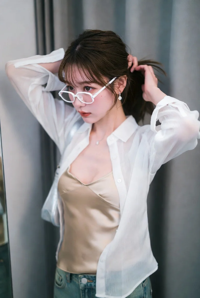 Athletic Korean woman poses in mirror-lined changing area with VHS effect
