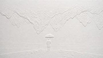Blind embossed paper artwork casts subtle white shadows across textured surface