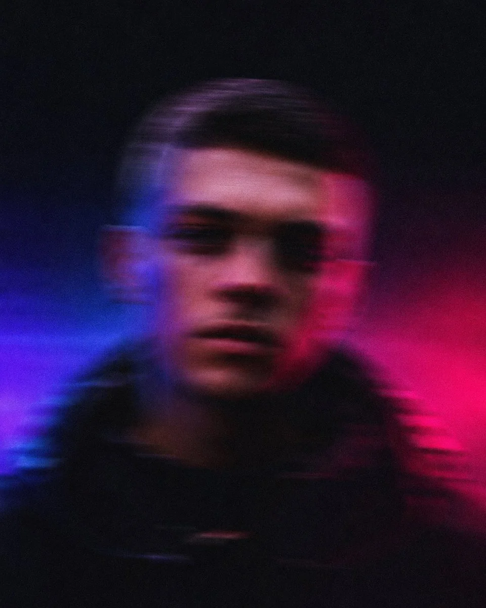 Blurred European man in streetwear faces camera with intense motion blur