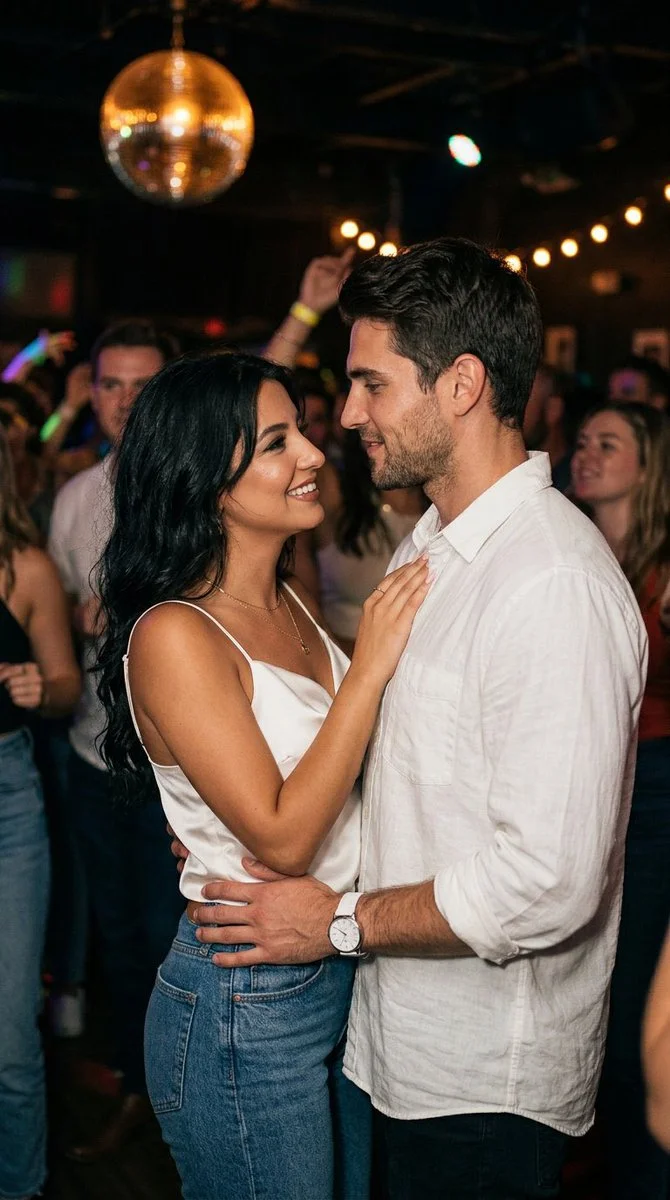 Candid Romance: A Couple's Gentle Dance in a Cozy Night Venue