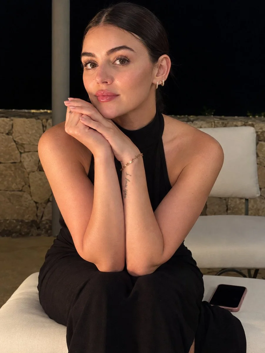 Cinematic Portrait of a Woman in Black Dress Under Warm Night Lights