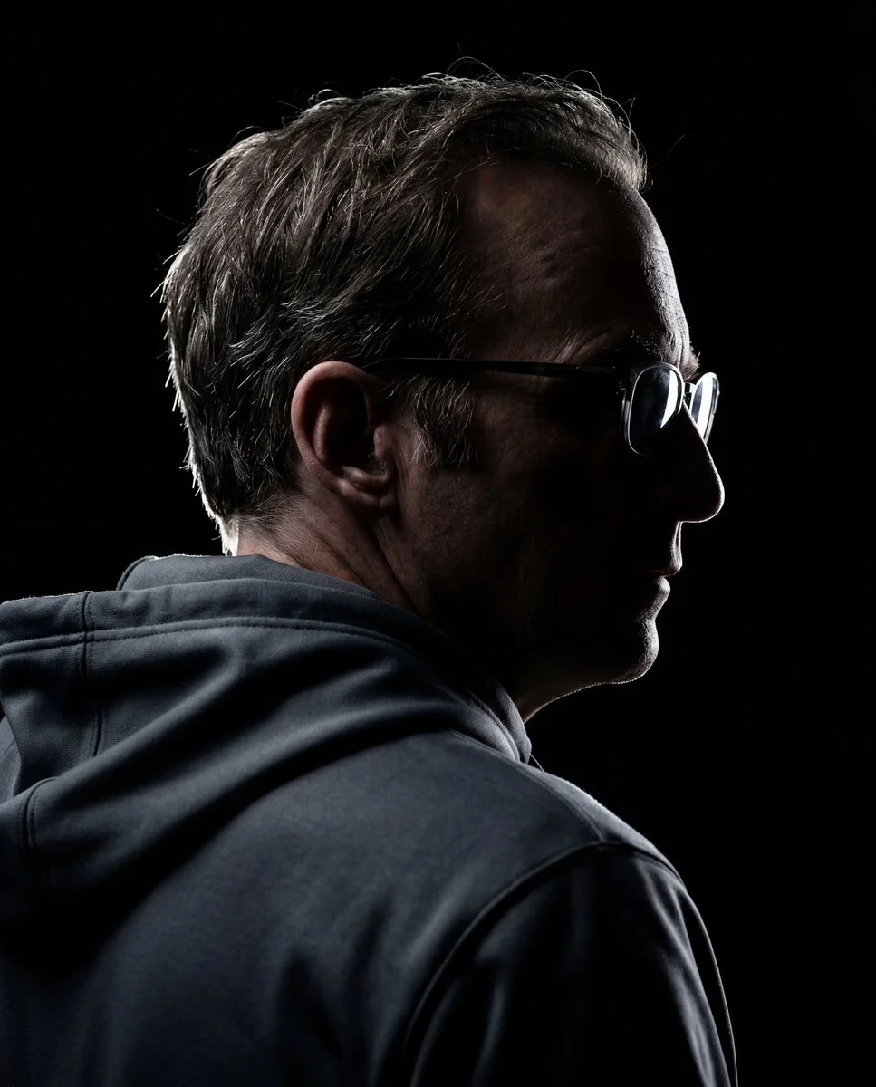 Cinematic Silhouette of a Man in Dark Grey Hoodie with Rim Light