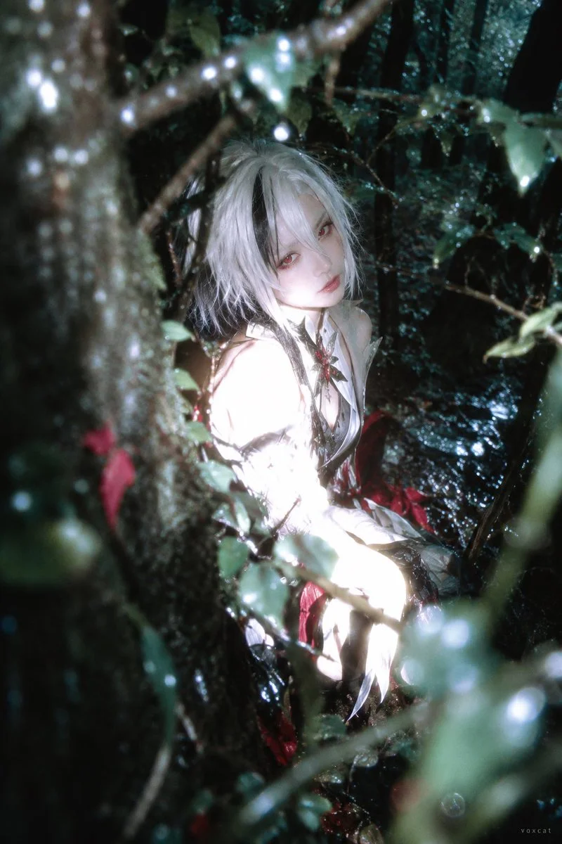 Close Flash Overexposes a Figure Turning Inside a Deep Green Forest