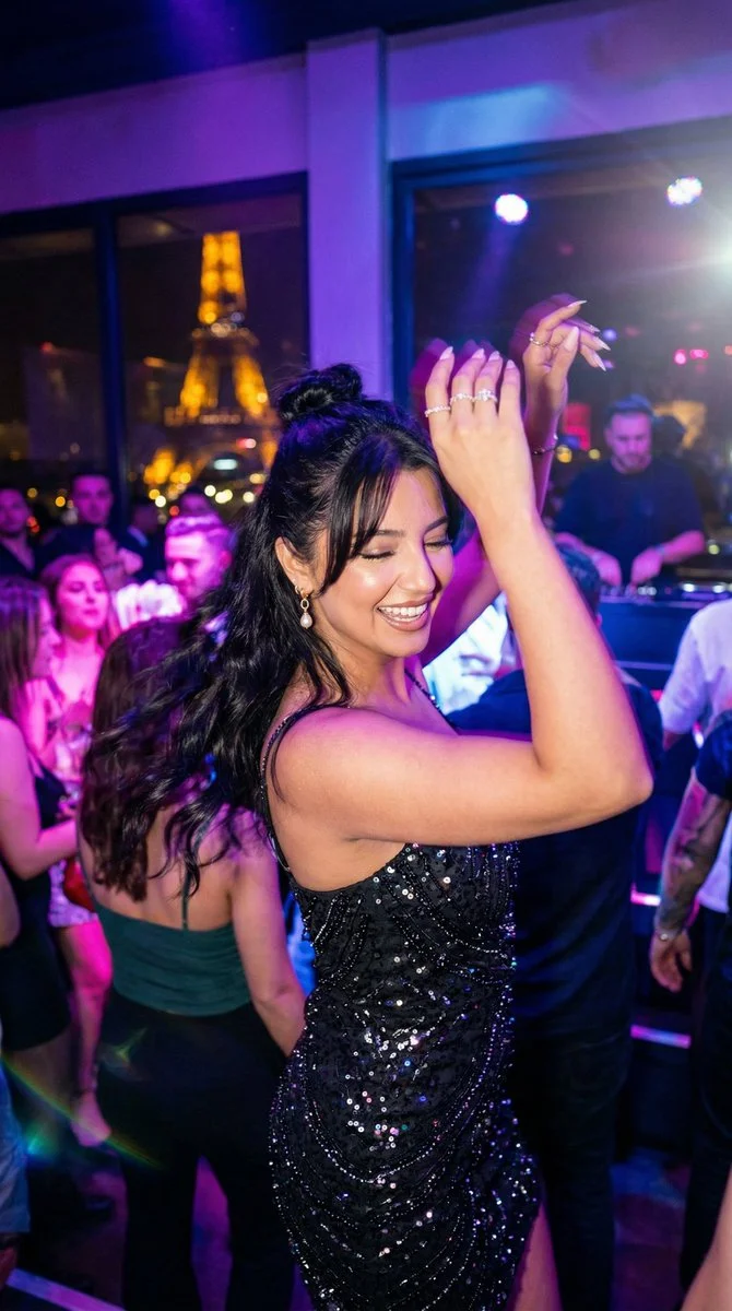 Confident Dance Under Paris Neon Lights