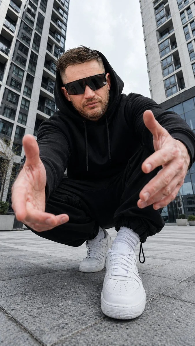 Confident Streetwear Stance in a Cinematic Urban Plaza