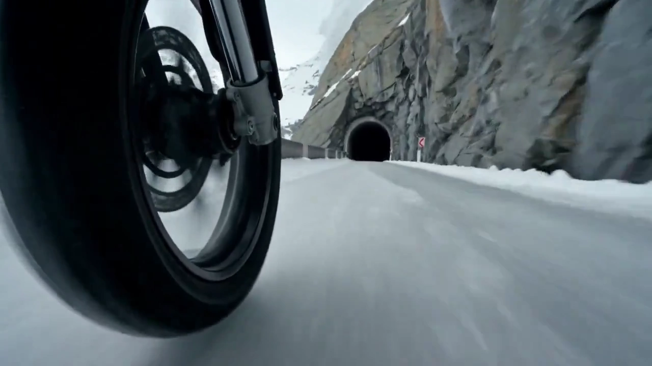 Frozen Edge Flight: Motorcycle Leaps Through Snowstorm