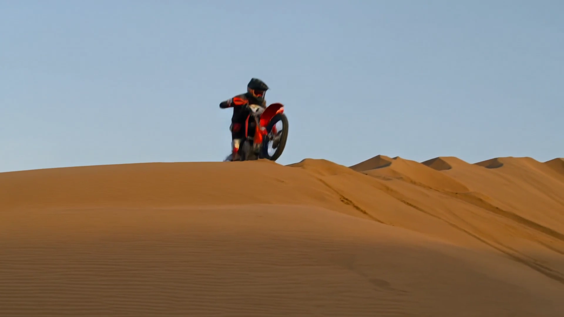 High-Speed Motocross Chase Through Ochre Desert Valleys