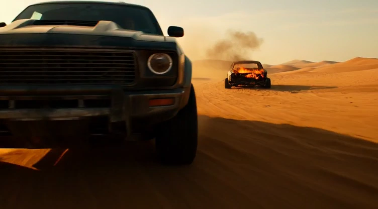 Desert Fury: Ultra-Low Tracking Shot of Armored Muscle Car