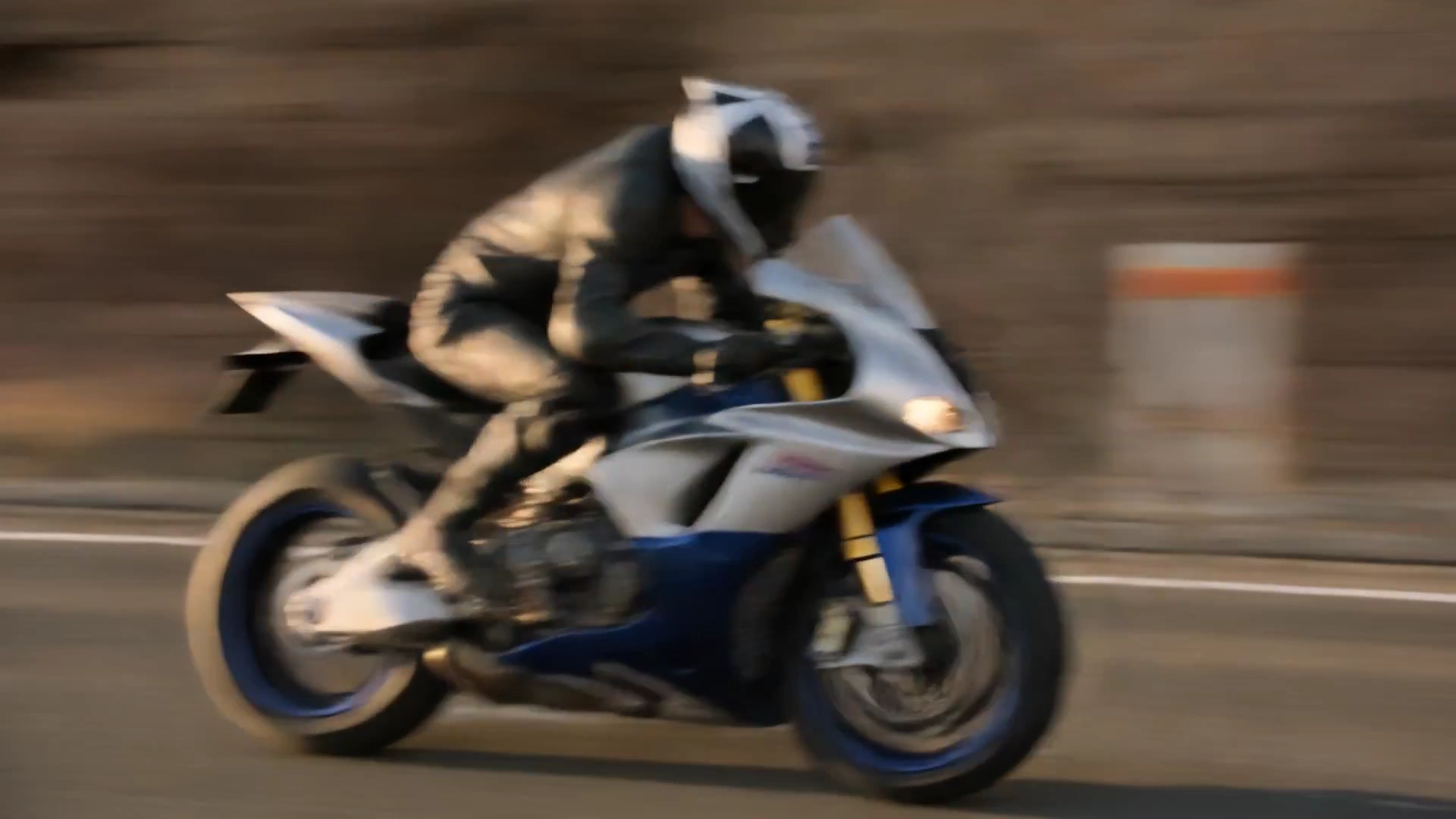 Canyon Sunset Escape: Motorcycle Launches Over Failing Road