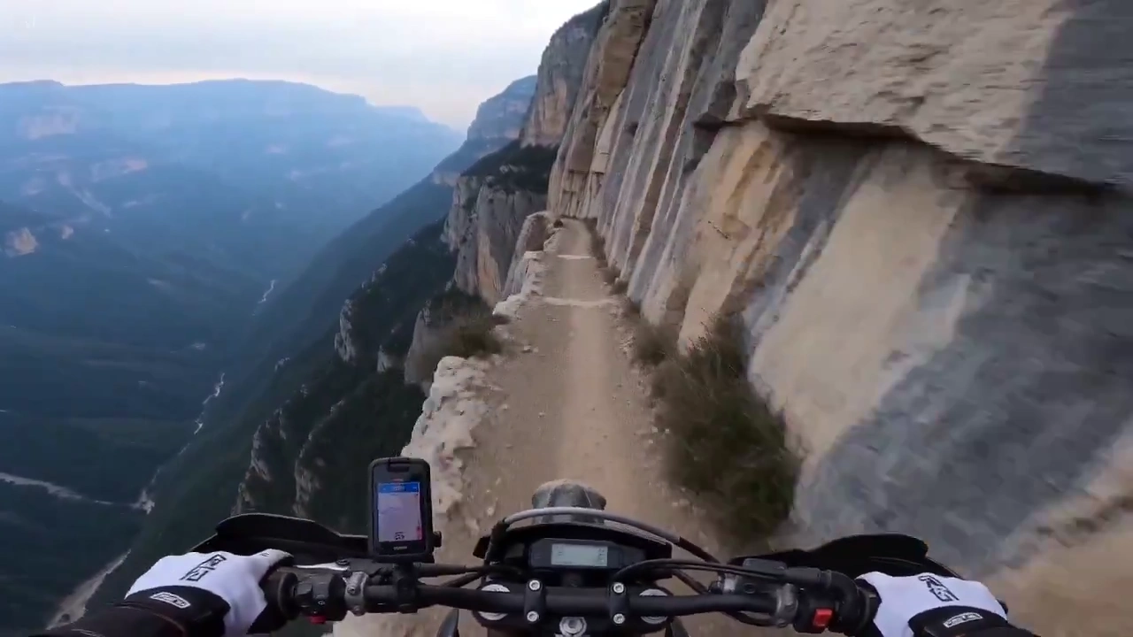 Vertigo-Inducing POV Motorcycle Journey on Cliff Edge Trail
