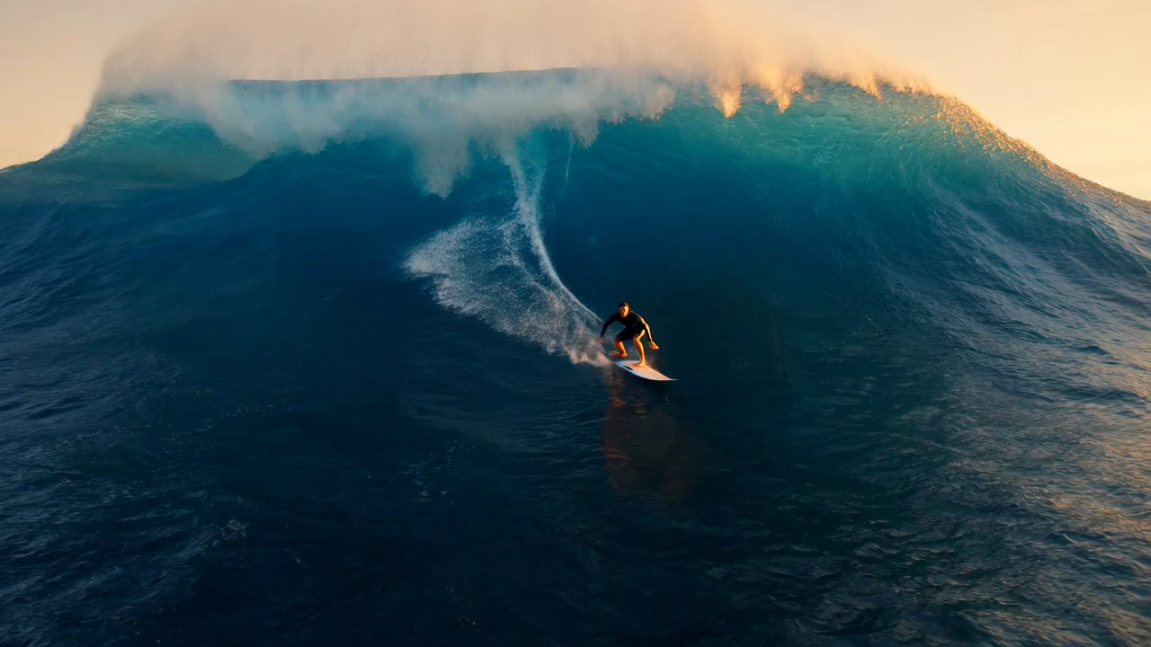 Surfer vs. Monster Wave: A Thrilling Sunset Showdown