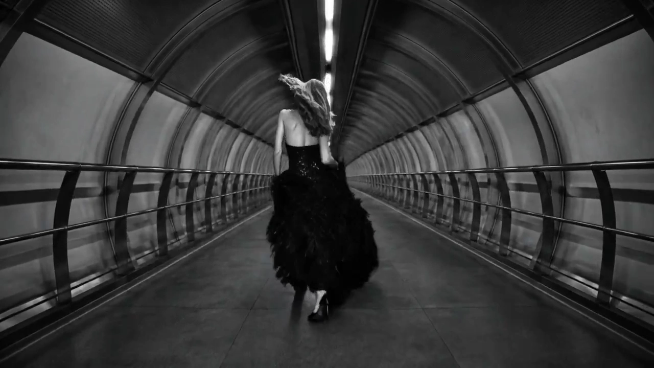 FPV Camera Sweeps Past a Couture Gown in a Dark Tunnel