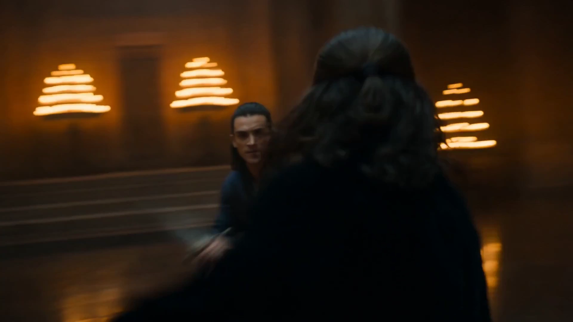 Flowing Robes and Steel Blades Dance in Amber Glow