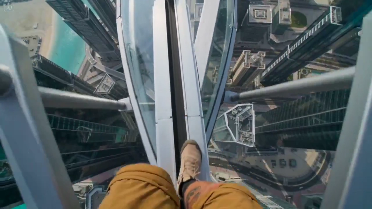 Vertigo Induced as You Cross a High-Tech Bridge Above the City