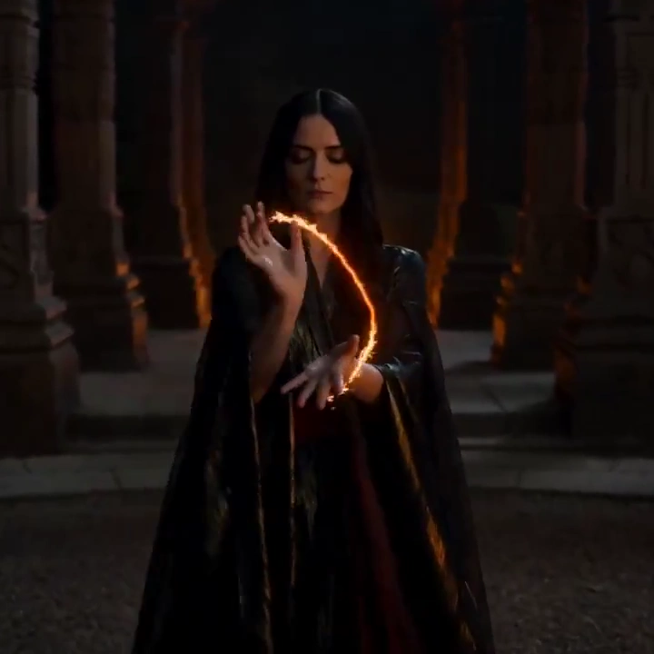 Flames Obey Her Gestures in a Dark Stone Courtyard at Night