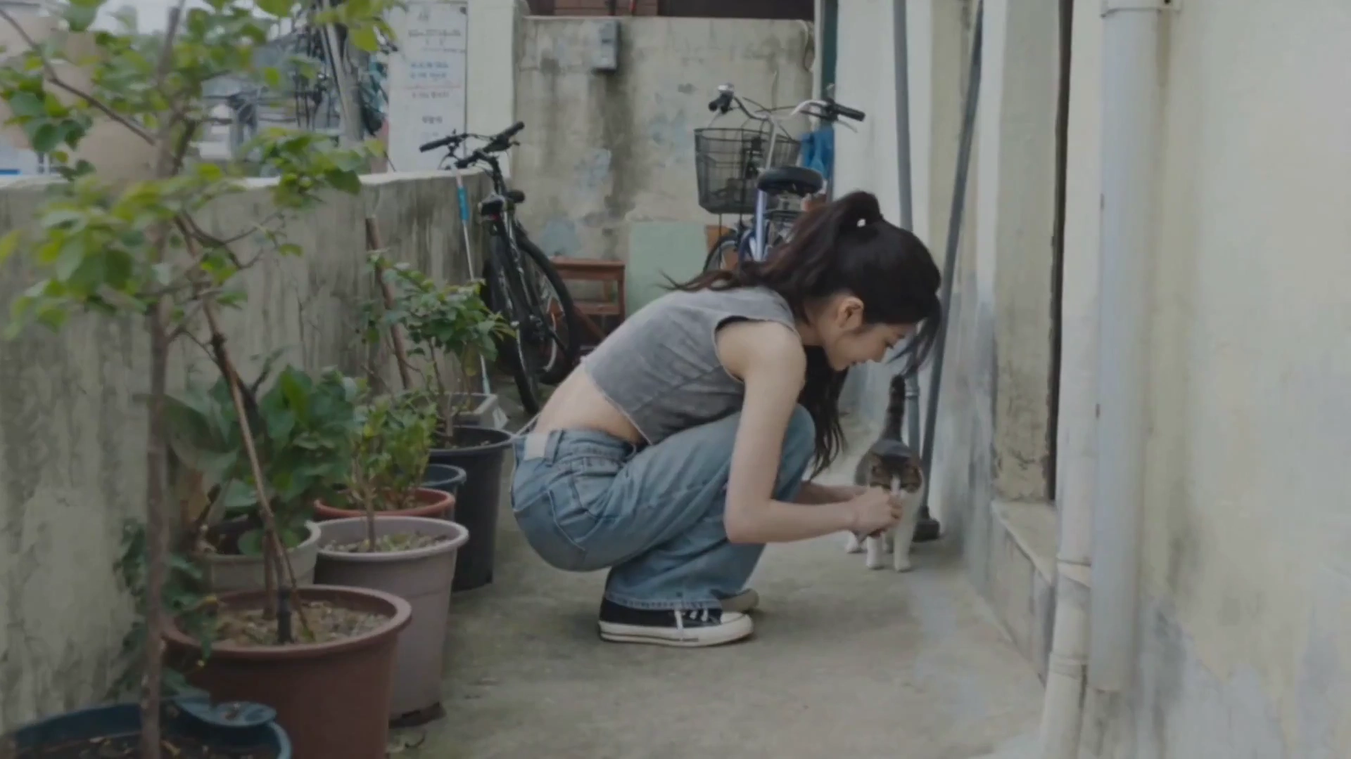 Grainy Footage Shows Her Waving and Smiling in Narrow Alleys