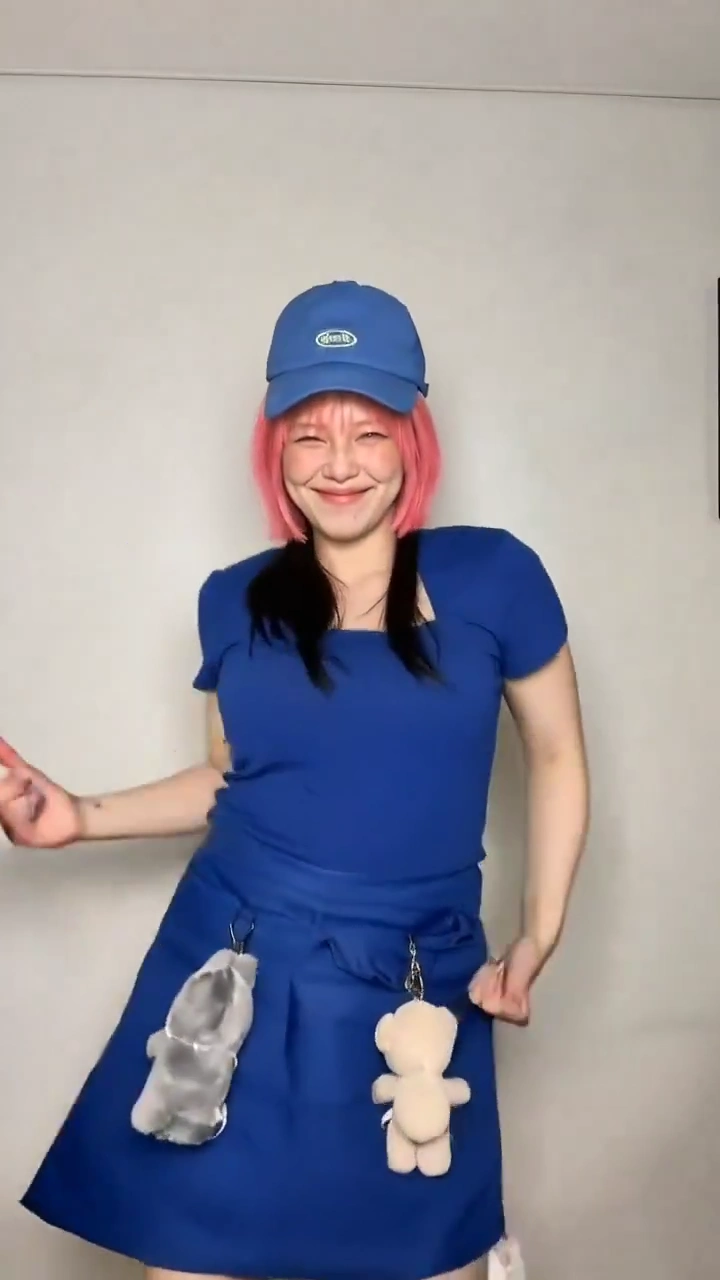 Energetic Dance Routine Features Playful Winks and Plush Keychains