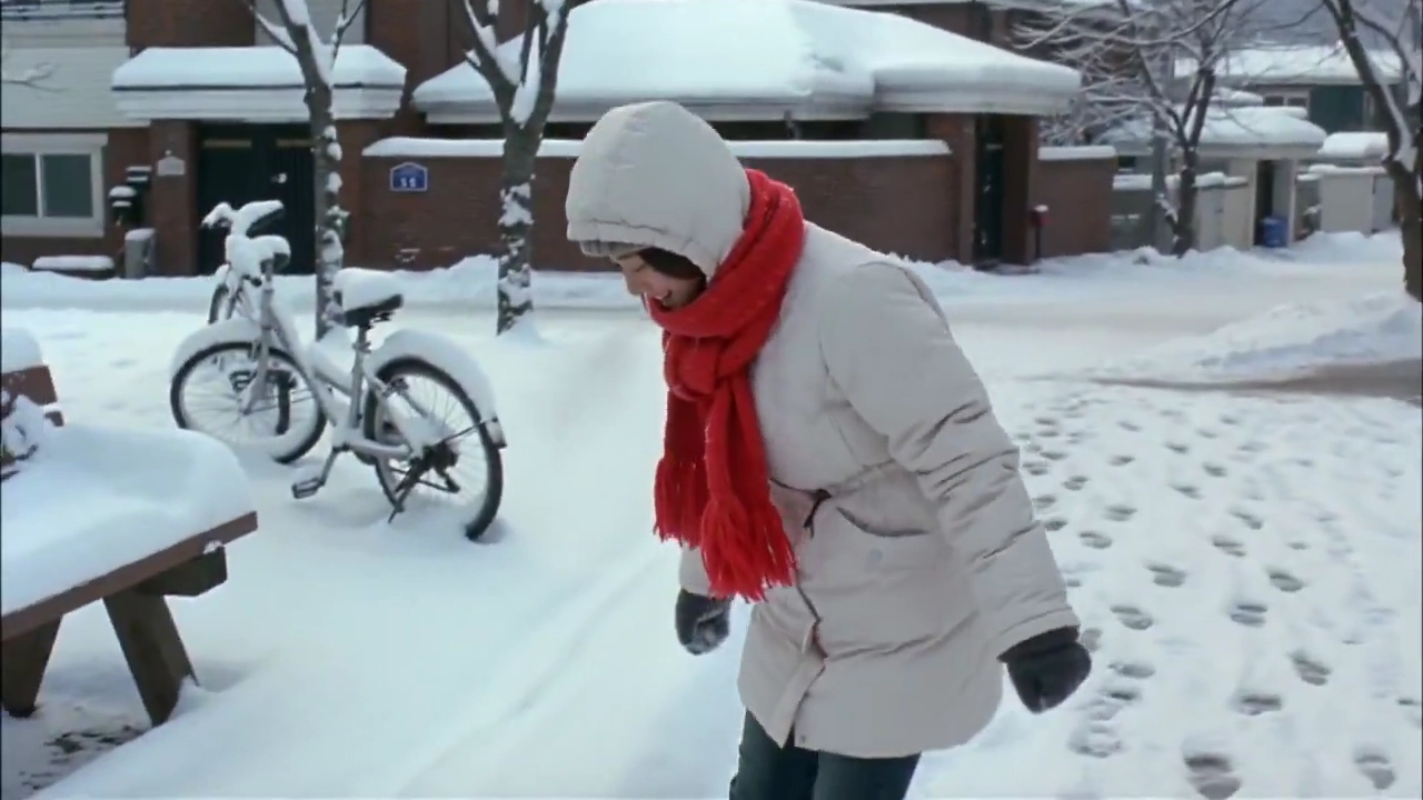 Playful Snowball Fight on a Quiet Winter Morning Street