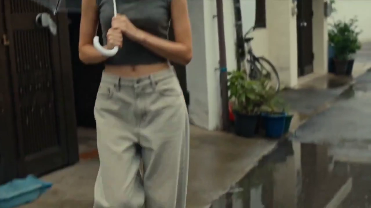 Raindrops Fall on Umbrella as Girl Laughs in Alley