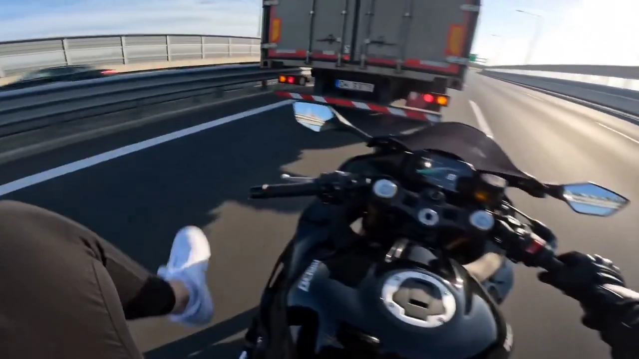 Fearless Woman Kicks Vehicles While Racing Down a Busy Highway