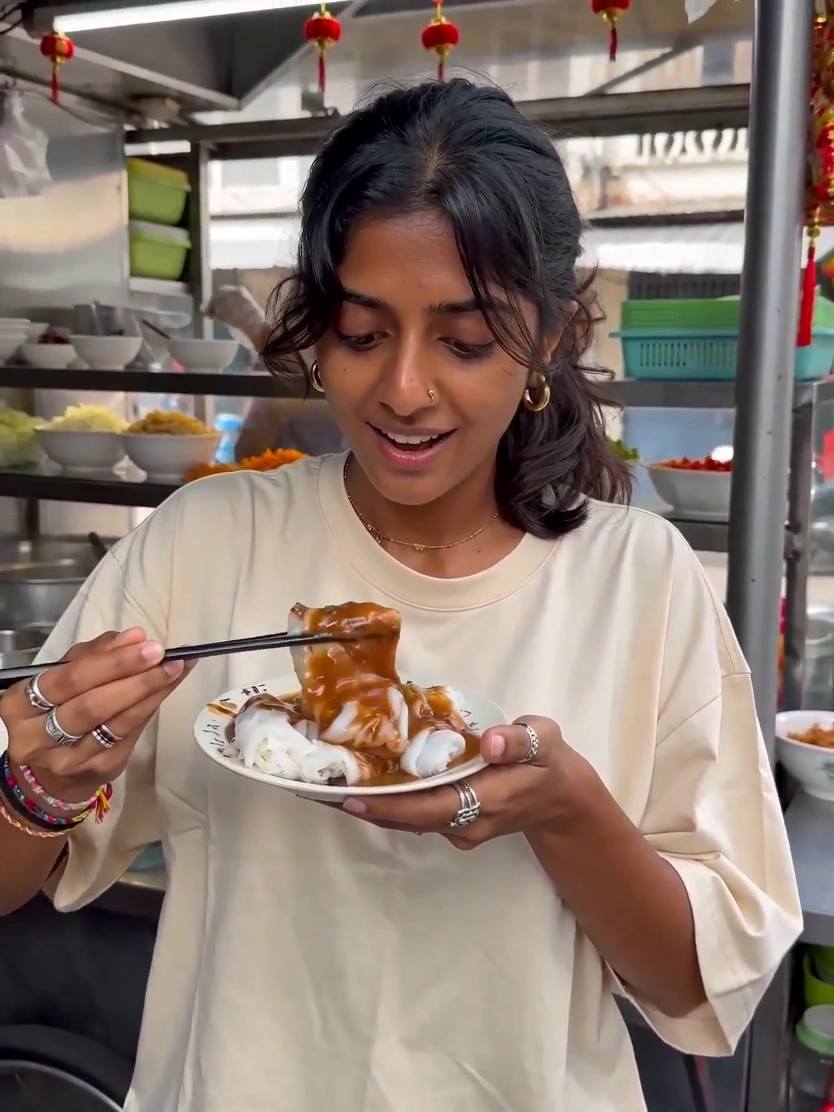 Startled by a Clatter, She Holds Chopsticks Suspended Above Her Meal