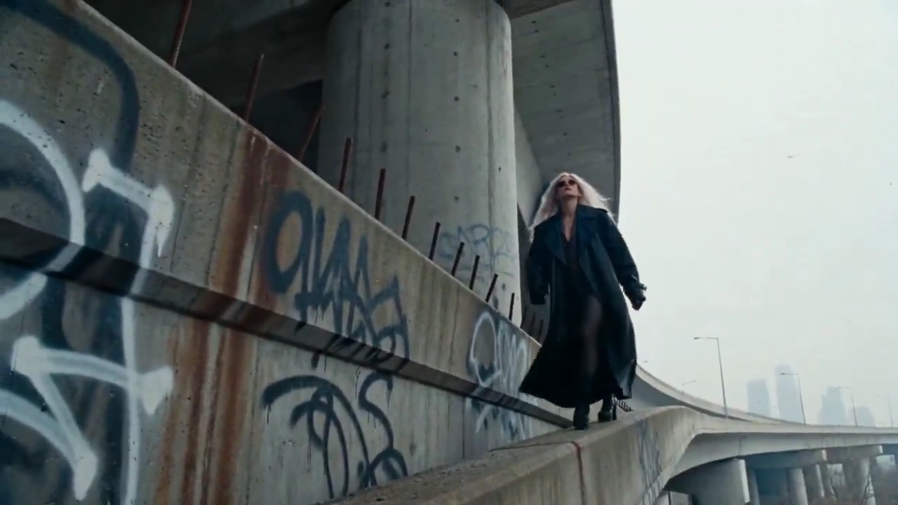 Blonde Hair Whipping in Wind on a Canted Concrete Bridge