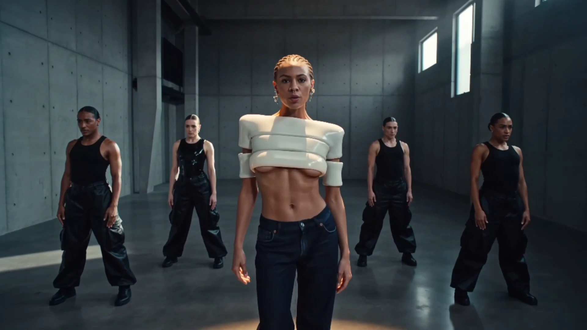 Cornrow Braids and Septum Ring Anchor a Stoic Performance
