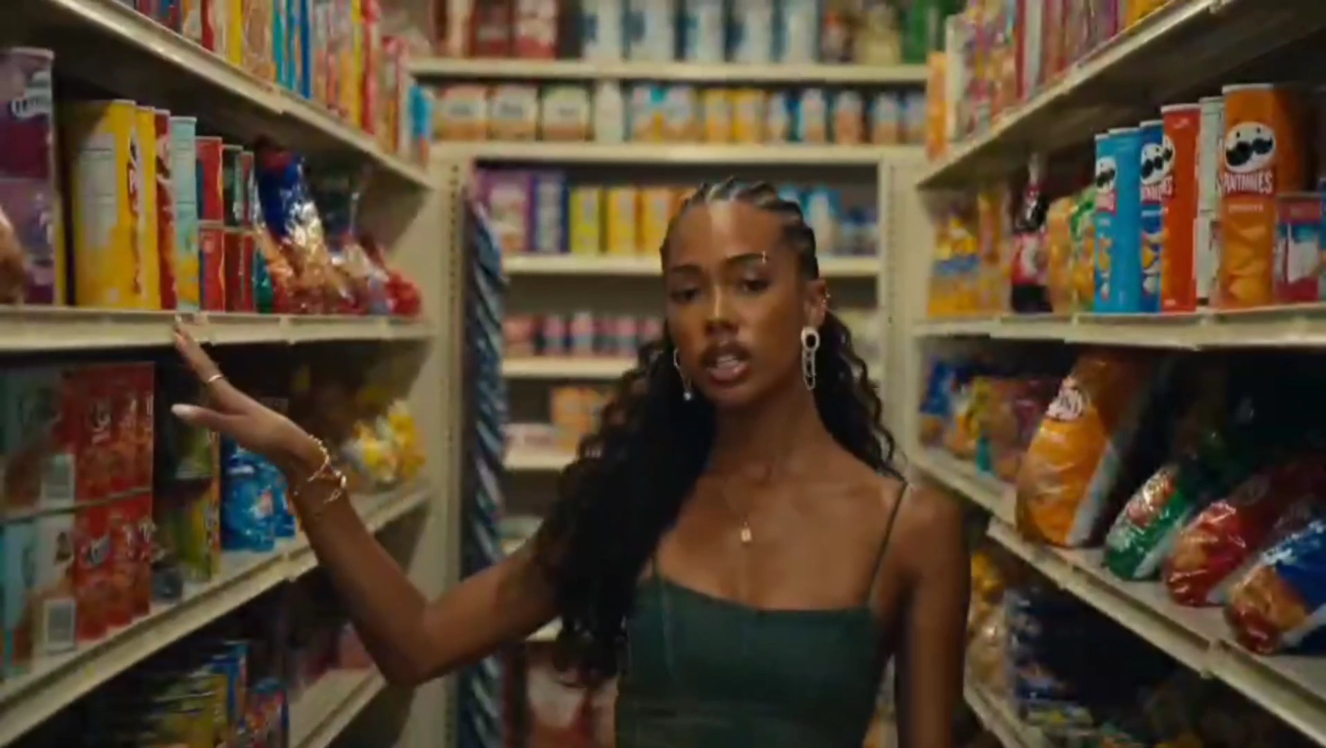 Cornrowed Artist Spits Verses in a Glowing Corner Store