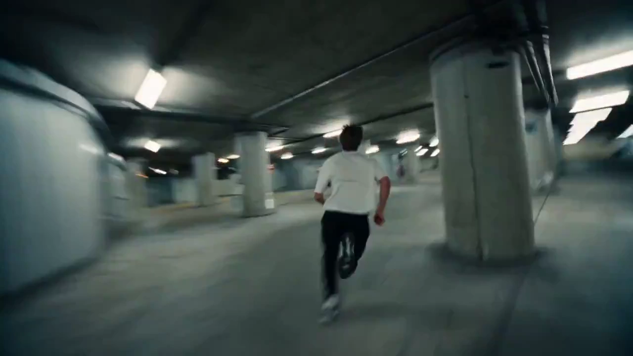 Exhausted Man in White Shirt Dashes Through Midnight City