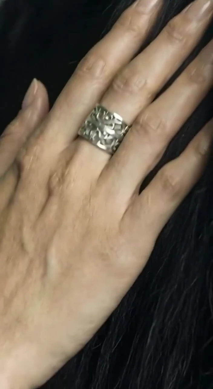 Elegant Fingers Weave a Glossy Braid Under Soft Cinematic Light