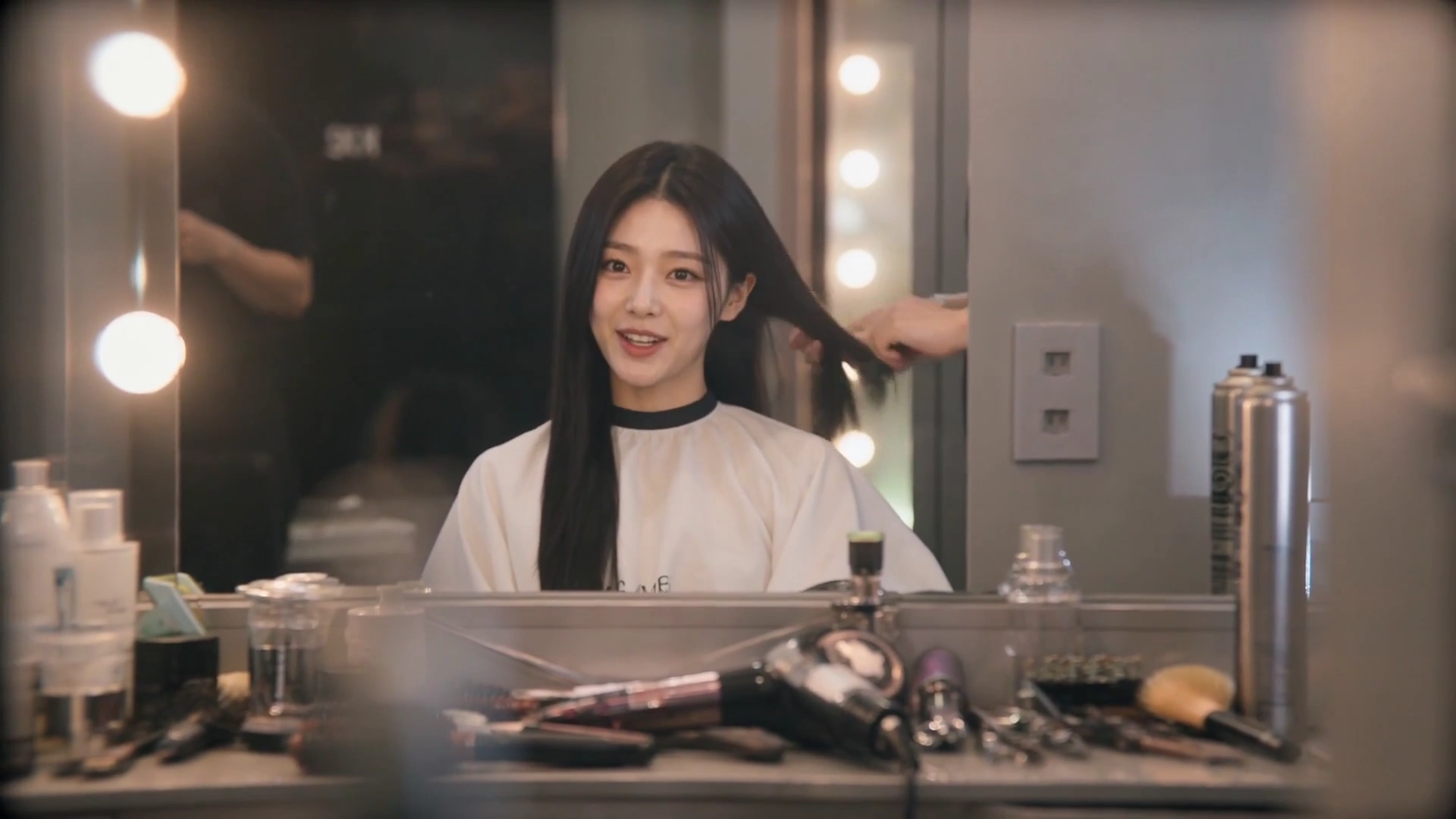 Glowing Vanity Lights Capture a Playful Hair Transformation