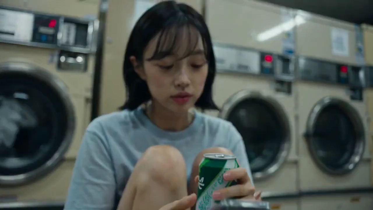 Candid Glimpses of Quiet Routine in a Fluorescent Laundromat
