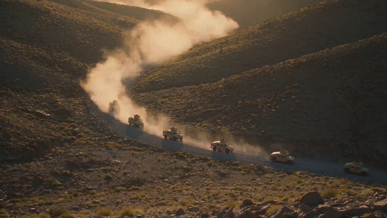 Soldiers Under Fire: Convoy Defends Against Ridge Attack in Dust