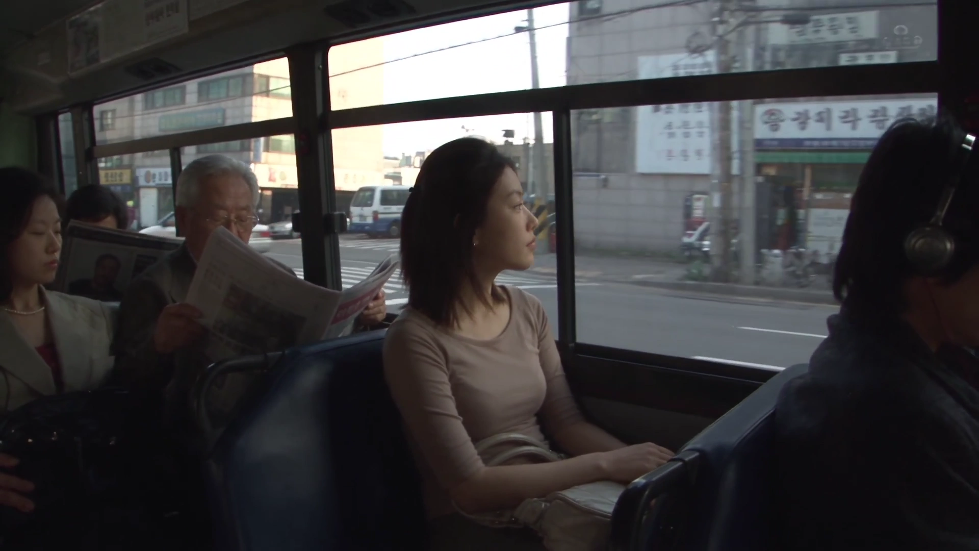 Grainy Camera Trails a Young Woman Through Vintage Streets