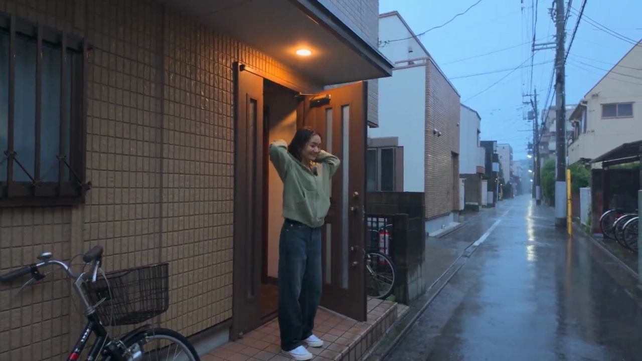 Handheld Camcorder Footage of a Rainy Night in Japan
