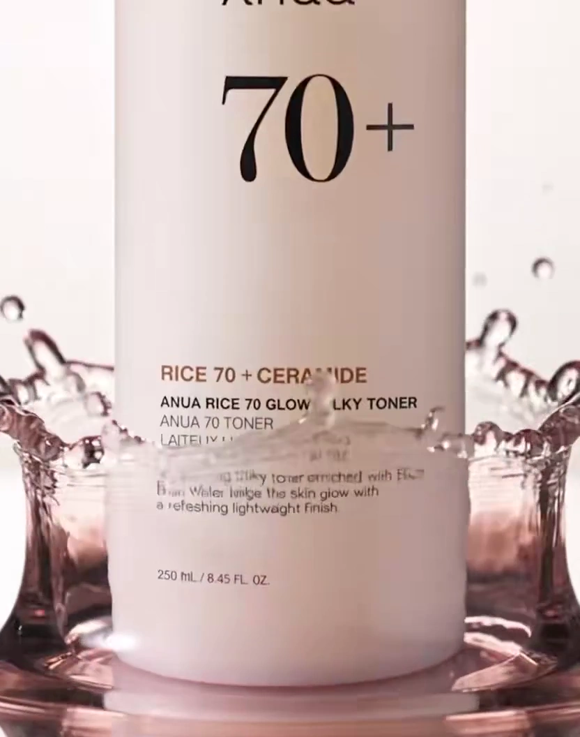 Milky Toner Drop Creates Elegant Ripples on Calm Water Surface