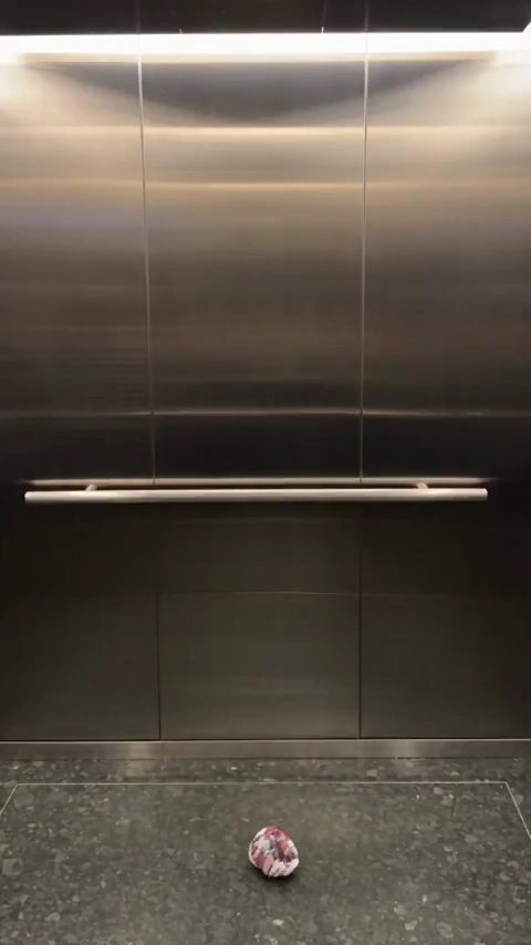 Stylish Commuter Wardrobe Morphs Through Crumpled Paper in Elevator Selfie Video