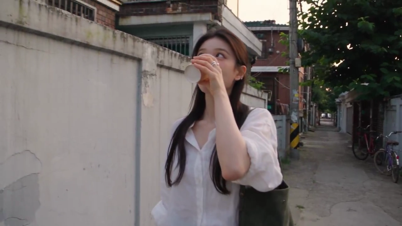 Handheld DV Footage Follows Woman Through Quiet Seoul Streets at Dusk
