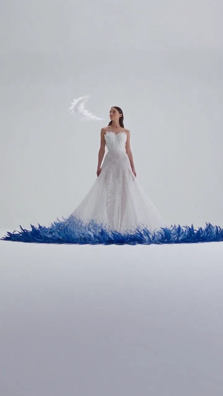 Sculptural Feather Halos Transform Around a Poised Couture Muse