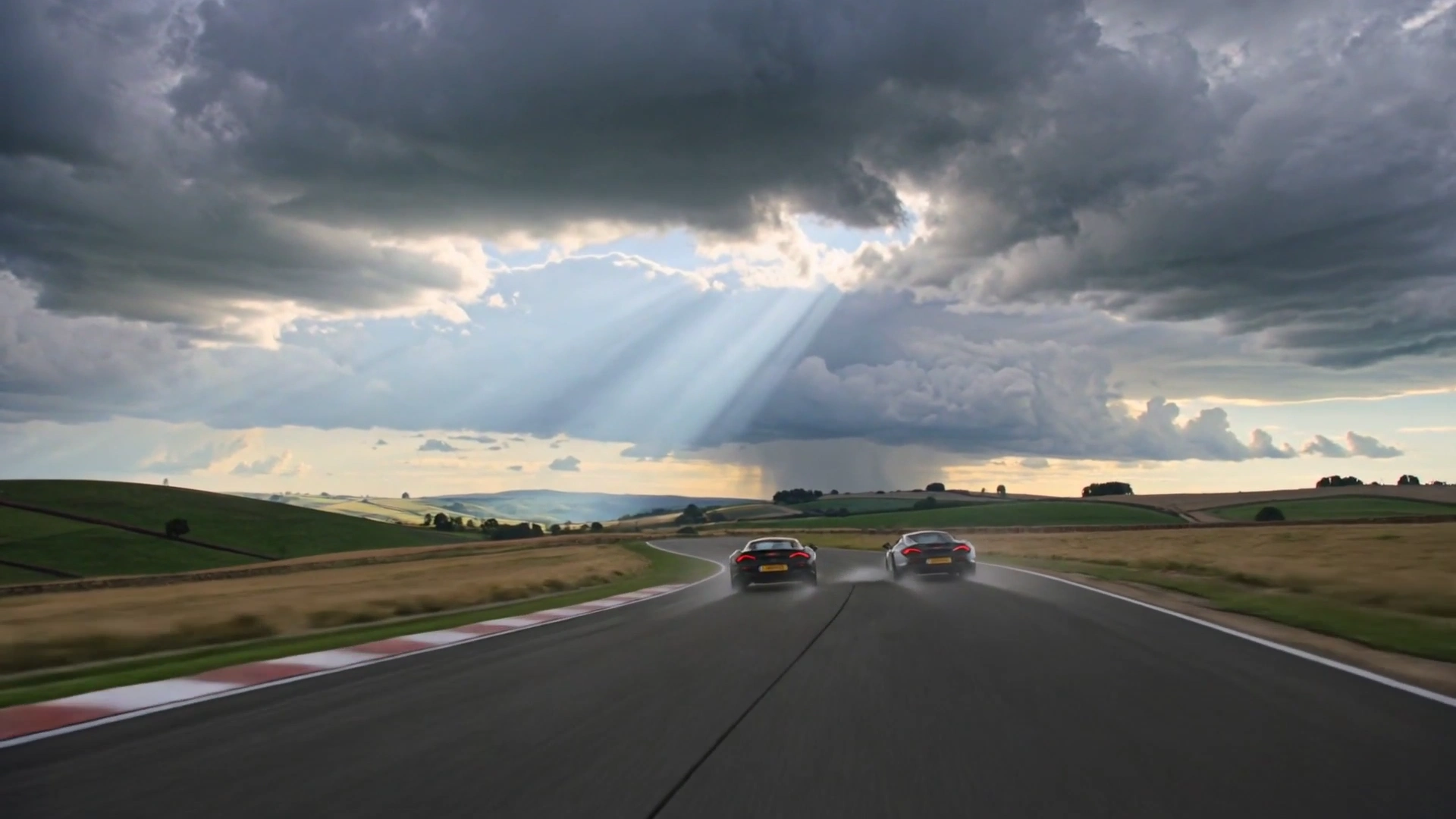 Two Performance Cars Duel as Summer Storm Soaks the Track