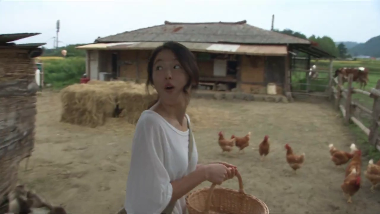 Handheld Camera Follows a Girl Through a Lively Farm Afternoon