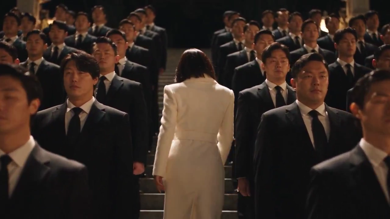 Ivory Coat Woman Stands Frozen While Crowd Snaps in Unison