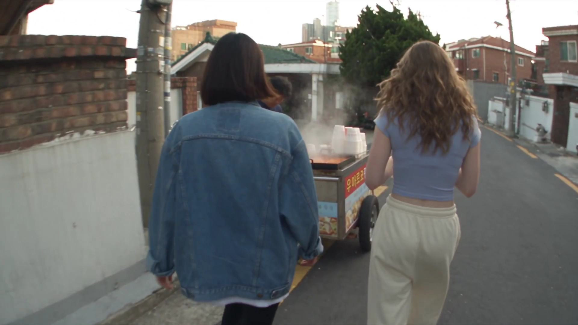 Handheld DV Footage Captures Lazy Afternoon Snacks And Shared Headphones