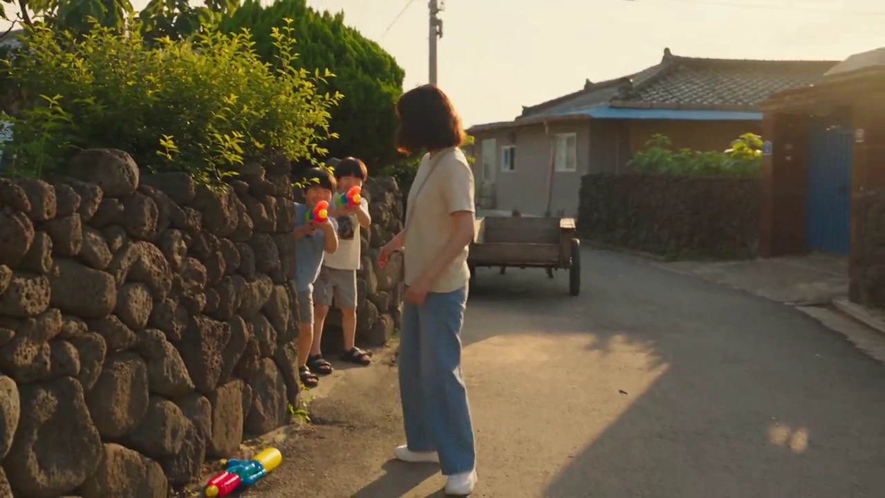 Sunlit Village Streets Erupt in Joyful Water Gun Chase
