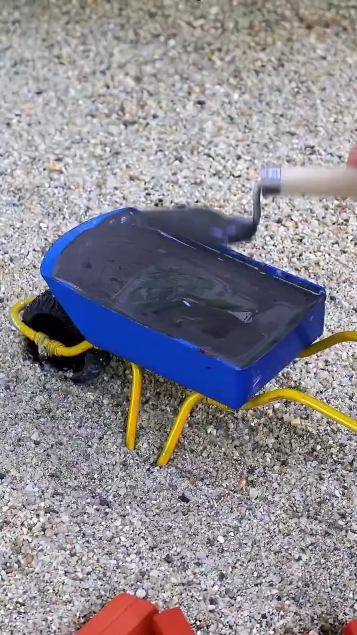 Miniature DIY House Rises Step by Step Under Giant Fingers