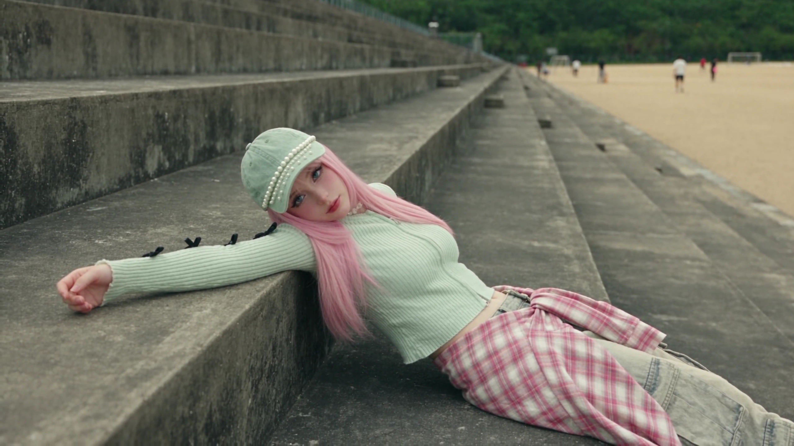 Pink-Haired Wanderer Drapes Across Playground Slide in Melancholic Daydream